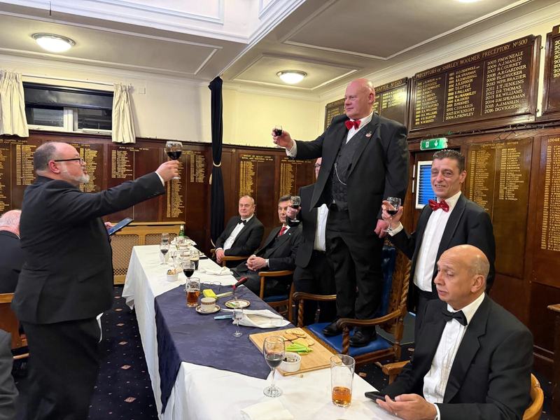 Brethren raising a toast at the Festive Board